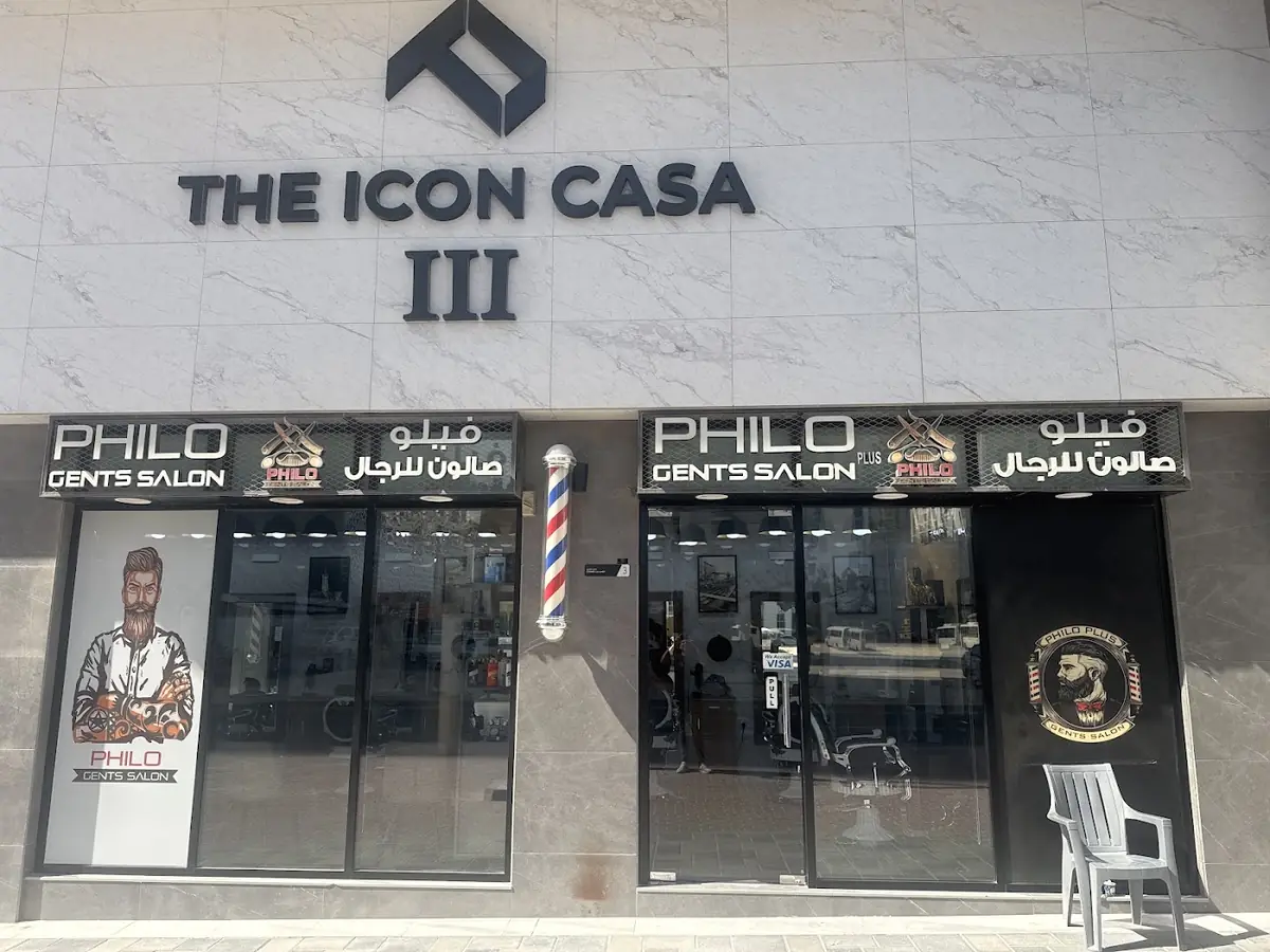 Philo Gents Salon storefront under The Icon Casa III sign, with the Arabic name and barber pole