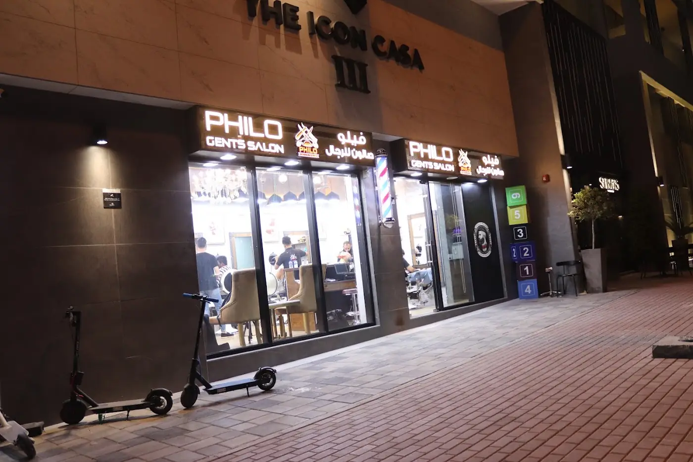 Philo Gents Salon storefront at night, The Icon Casa 3, JVC